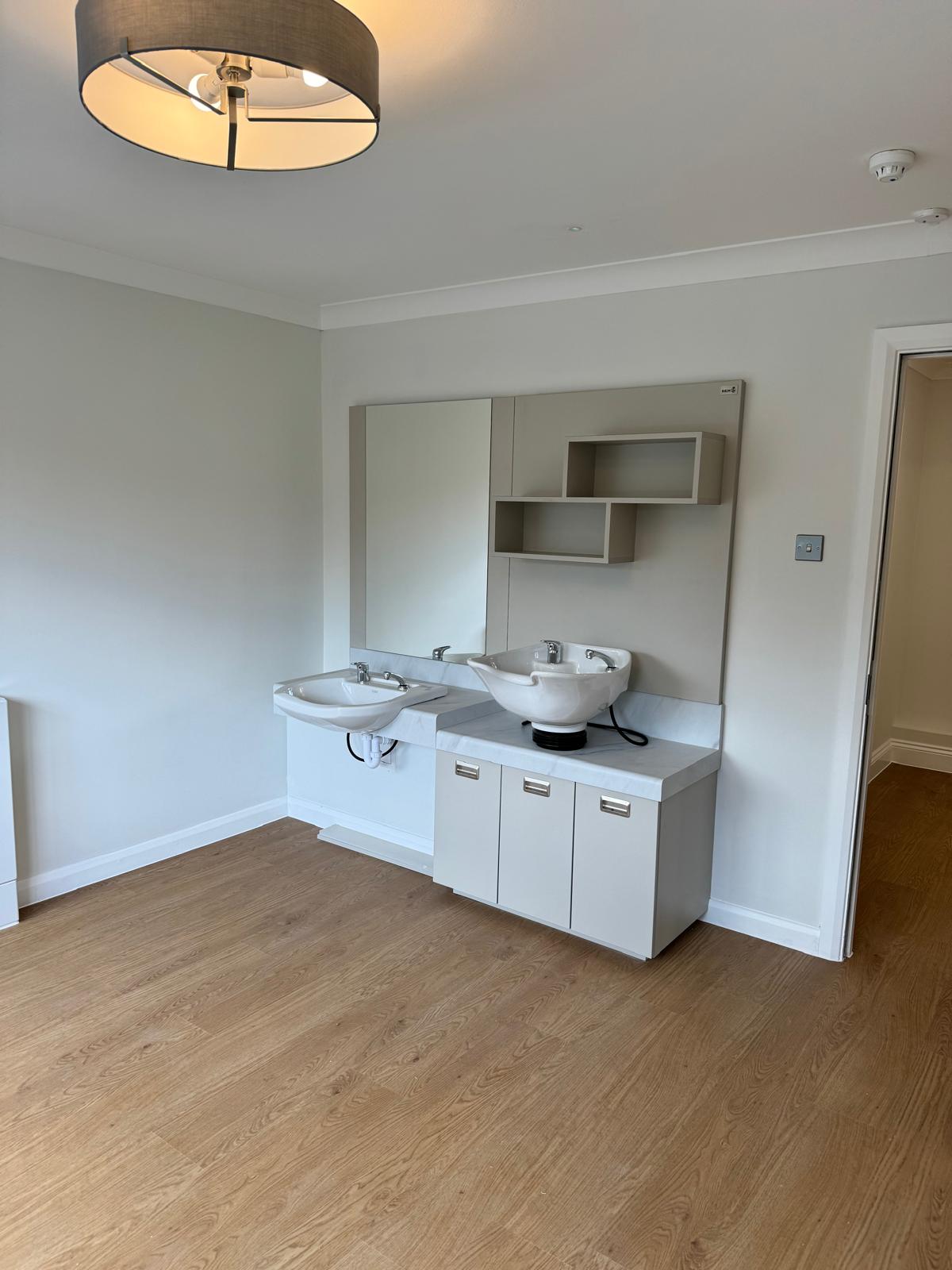 Belmont Healthcare corridor with feature lighting